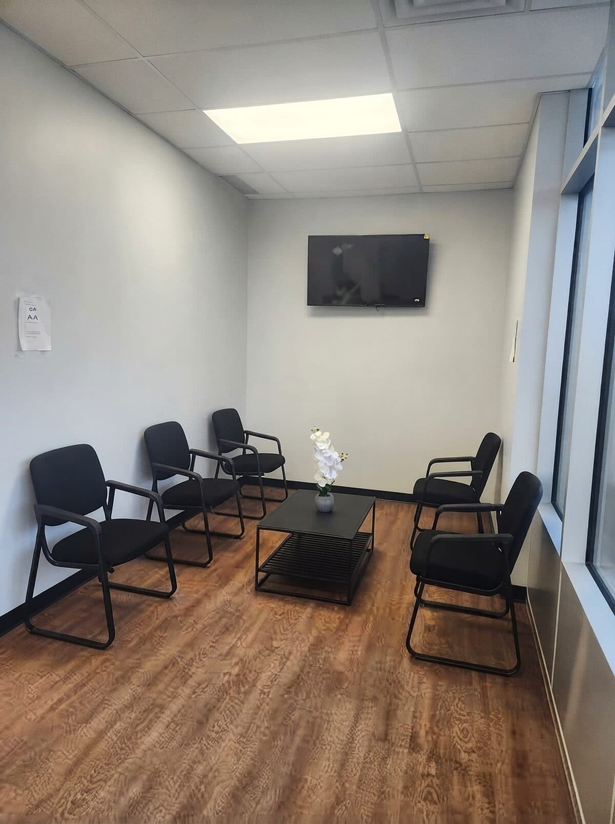 Waiting area with comfortable seating and natural light at Riverside Landing Dental